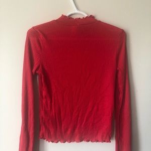 Red scalloped edge turtleneck